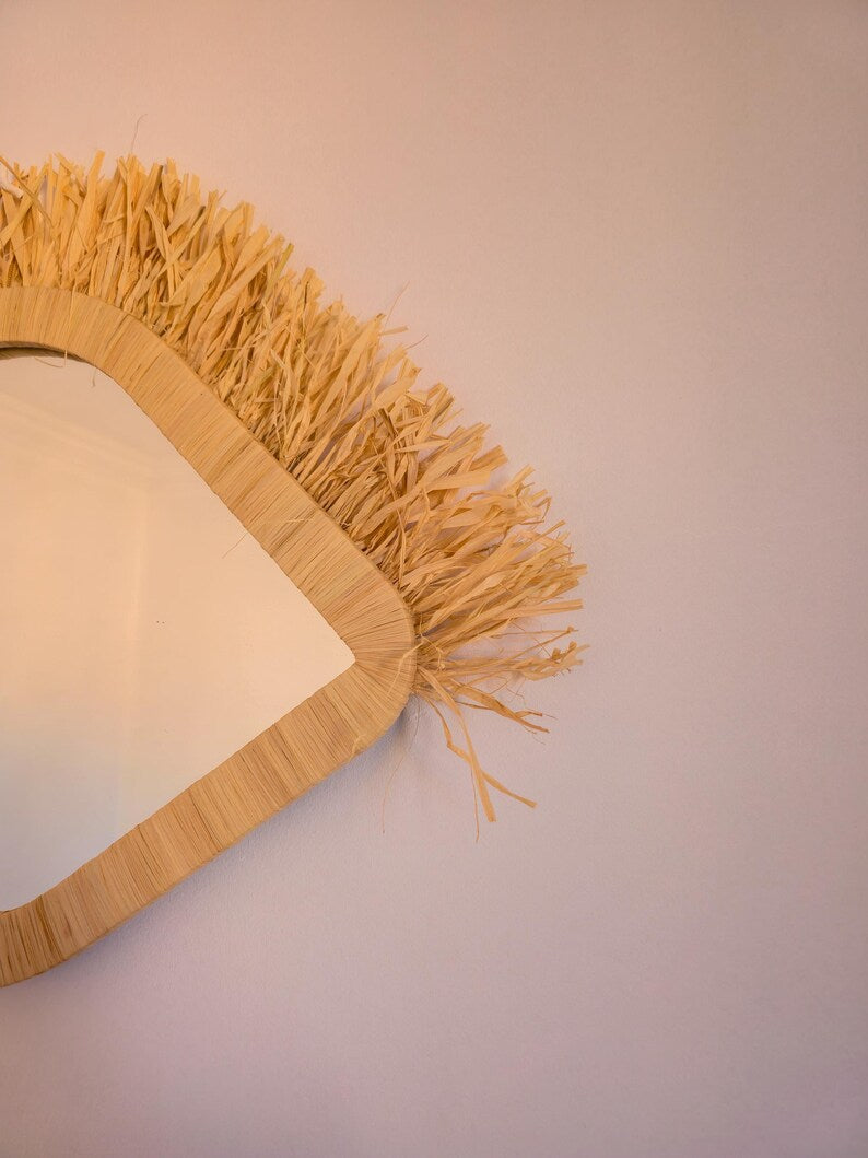 Moroccan raffia mirror in eye shape