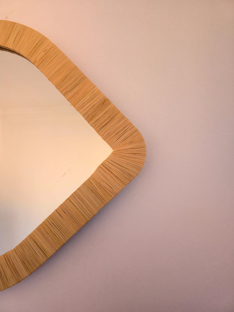 Moroccan raffia mirror in eye shape