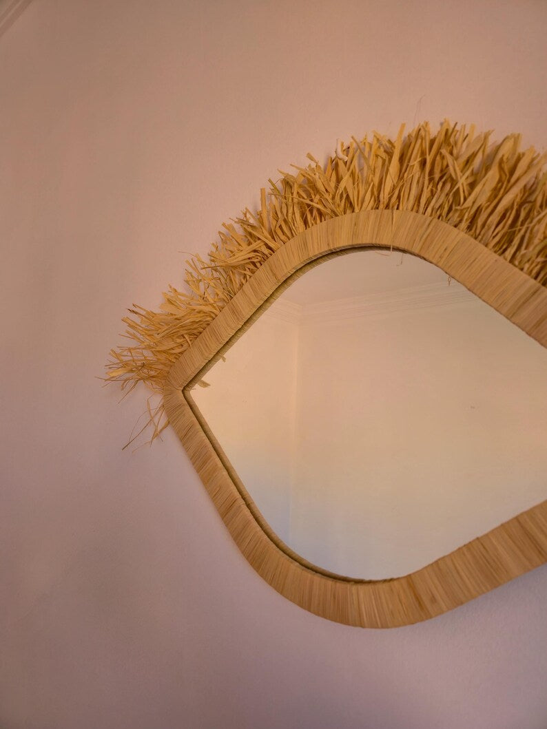 Moroccan raffia mirror in eye shape