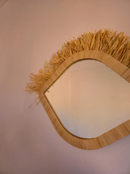Moroccan raffia mirror in eye shape
