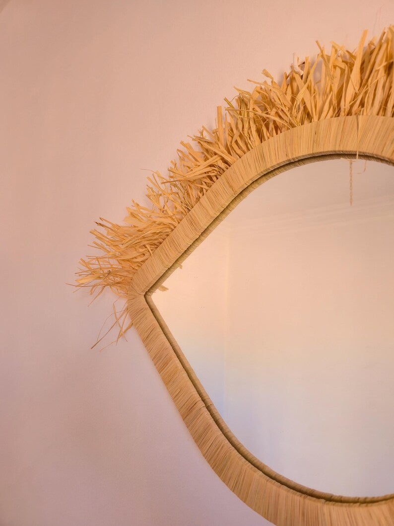 Moroccan raffia mirror in eye shape